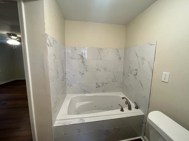 858 Eyers Road Memphis, TN 38109 - Photo 12 of 27 a bath tub sitting next to a white toilet