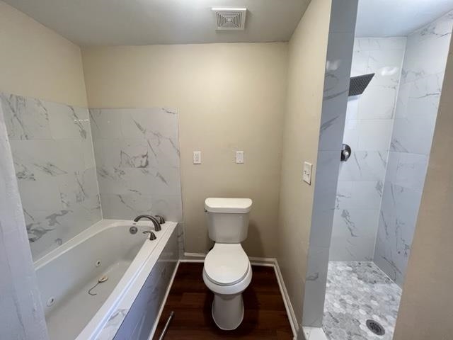 858 Eyers Road Memphis, TN 38109 - Photo 18 of 27 a bathroom with a toilet sink and shower