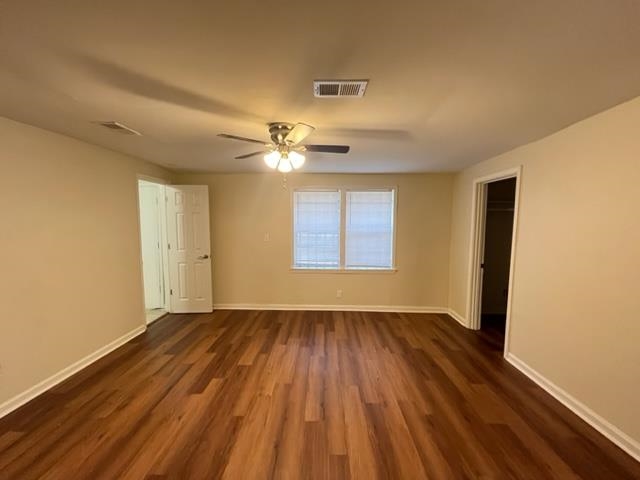 858 Eyers Road Memphis, TN 38109 - Photo 2 of 27 a view of an empty room with wooden floor and a window