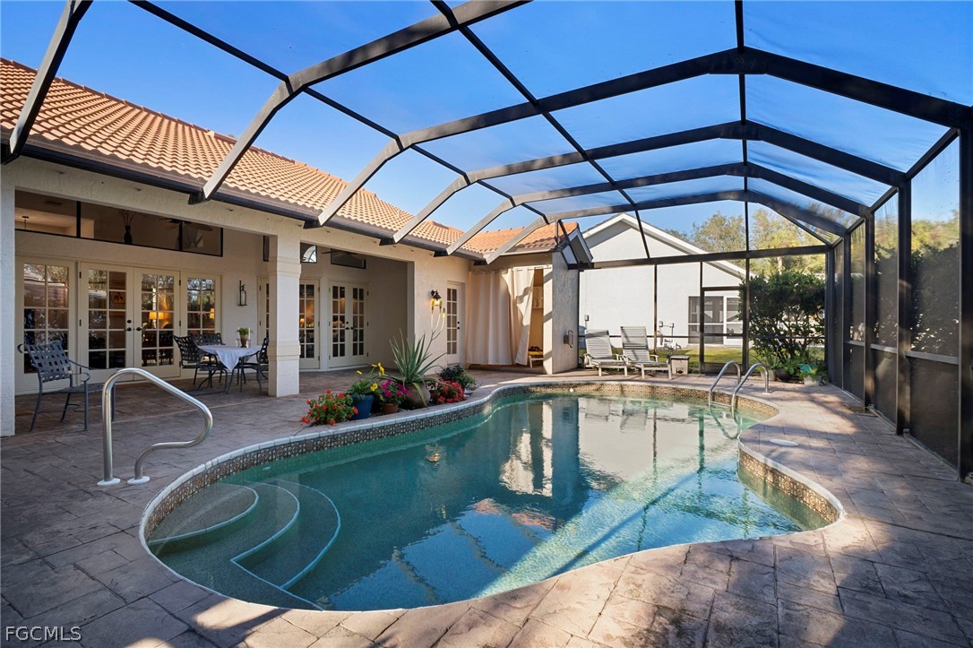 11772 Mahogany Run Fort Myers, FL 33913 - Photo 44 of 50 a view of a swimming pool with a patio