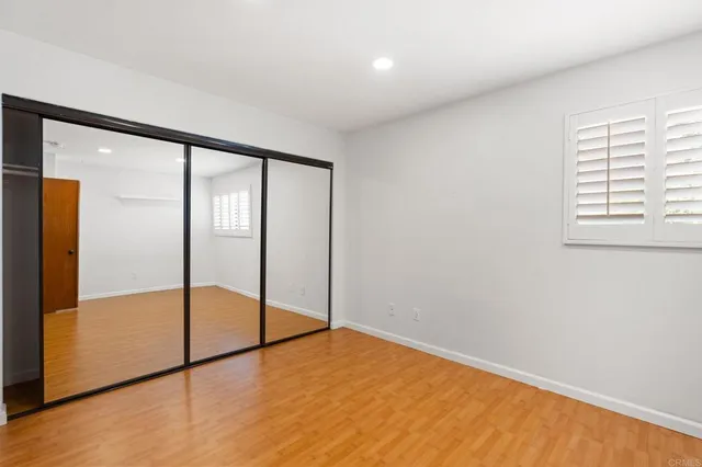 a view of an empty room with glass door