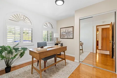 a workspace with furniture and window