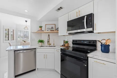 a kitchen with a stove and a microwave