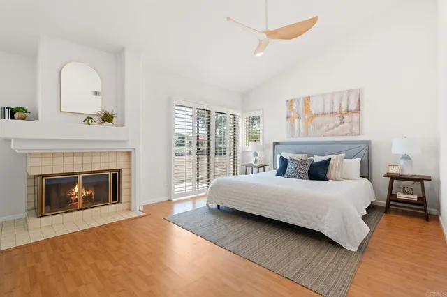 a bedroom with a bed and a fireplace