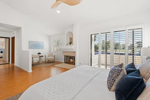 a bedroom with furniture and a fireplace