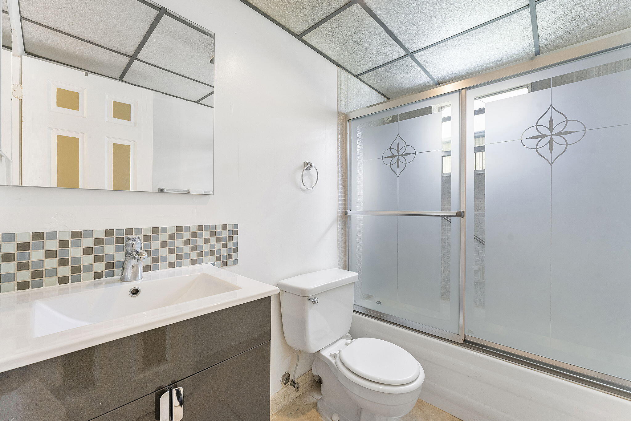 877 Flanders South Delray Beach, FL 33484 - Photo 17 of 27 a bathroom with a sink toilet and shower