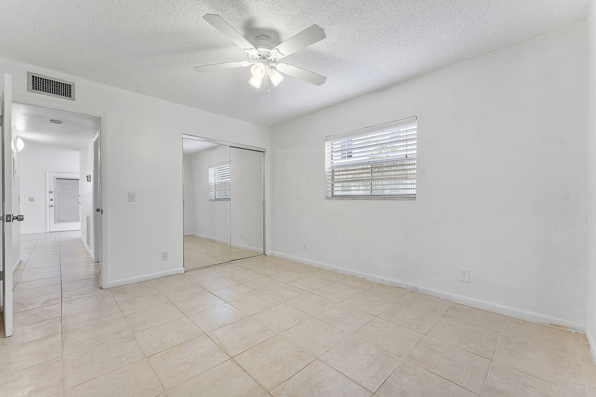 877 Flanders South Delray Beach, FL 33484 - Photo 20 of 27 a view of an empty room with a window