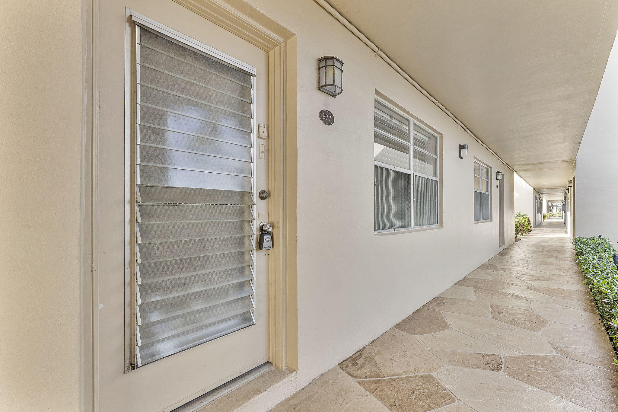 877 Flanders South Delray Beach, FL 33484 - Photo 3 of 27 a view of front door of the house