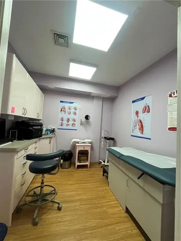 a living room with furniture and a pool table