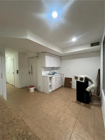 a view of a livingroom with furniture and cabinet