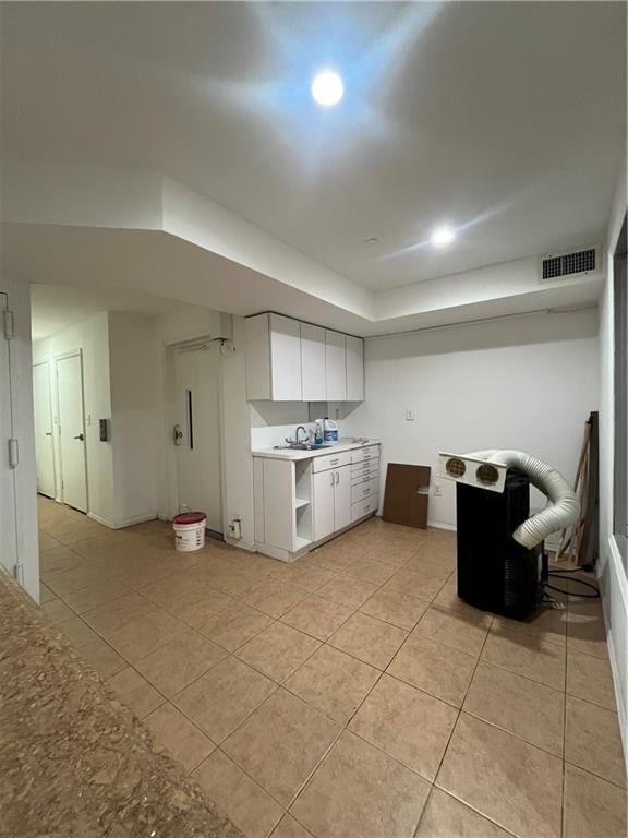 1729 East 16th Street Brooklyn, NY 11229 - Photo 7 of 10 a view of a livingroom with furniture and cabinet