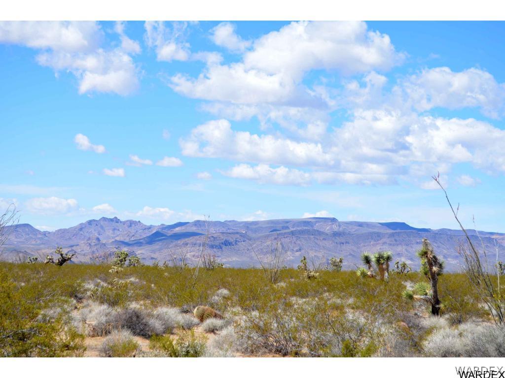 Lot 3385 Rainbow Road Yucca, AZ 86438 - Photo 8 of 13 a view of mountain and sunset