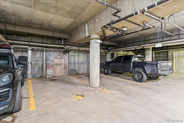 a view of parking garage with cars