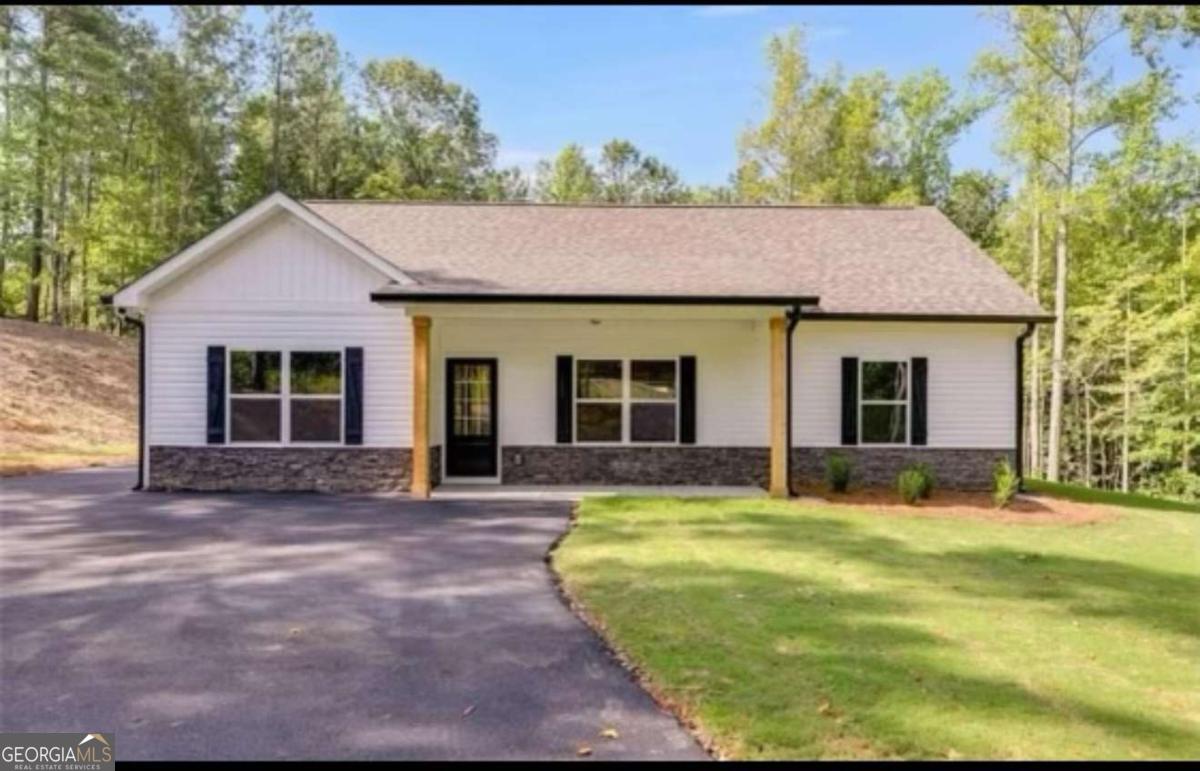 1081 Drummond Road Cedartown, GA 30125 - Photo 1 of 67 a view of a house with a yard and sitting area