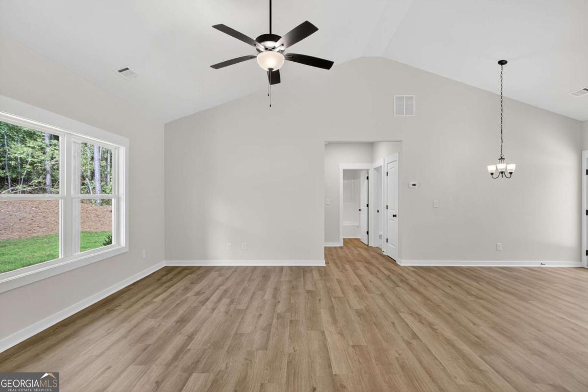 1081 Drummond Road Cedartown, GA 30125 - Photo 15 of 67 a view of empty room with wooden floor and fan