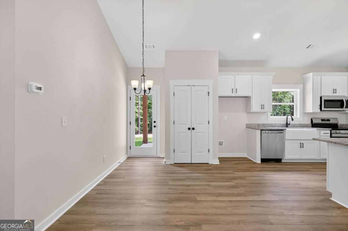 1081 Drummond Road Cedartown, GA 30125 - Photo 19 of 67 a view of cabinets and wooden floor