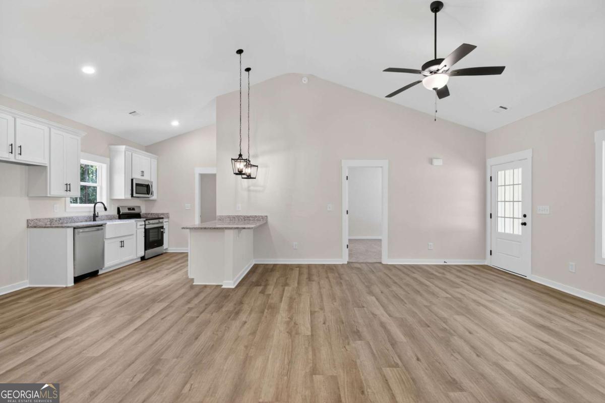 1081 Drummond Road Cedartown, GA 30125 - Photo 21 of 67 a view of kitchen with wooden floor and window