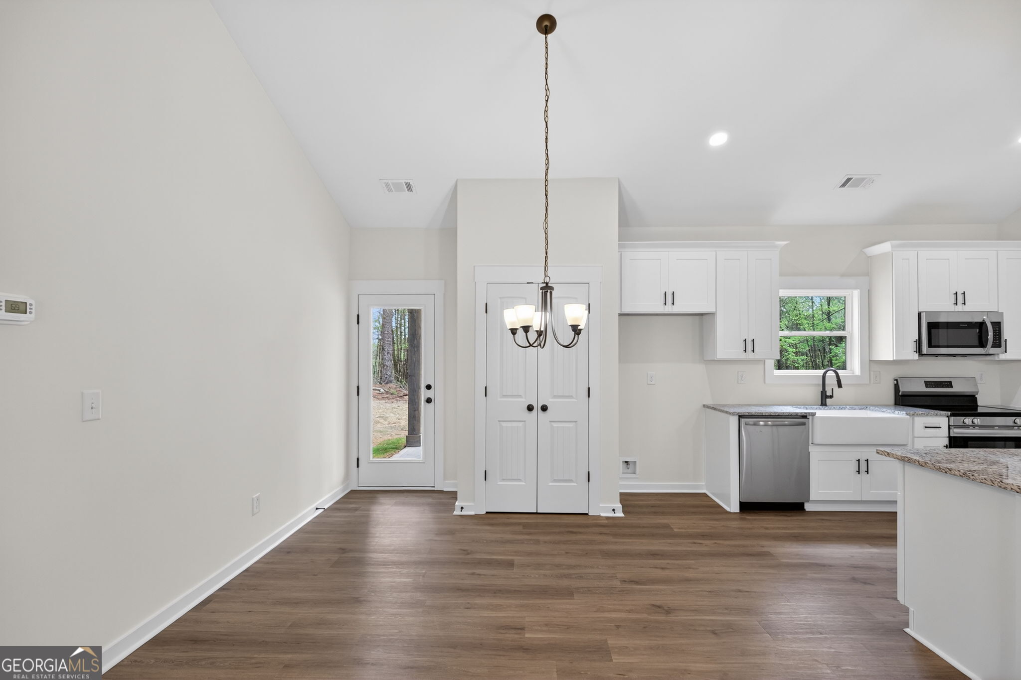 1081 Drummond Road Cedartown, GA 30125 - Photo 28 of 67 a view of a kitchen with a sink wooden floor and a window