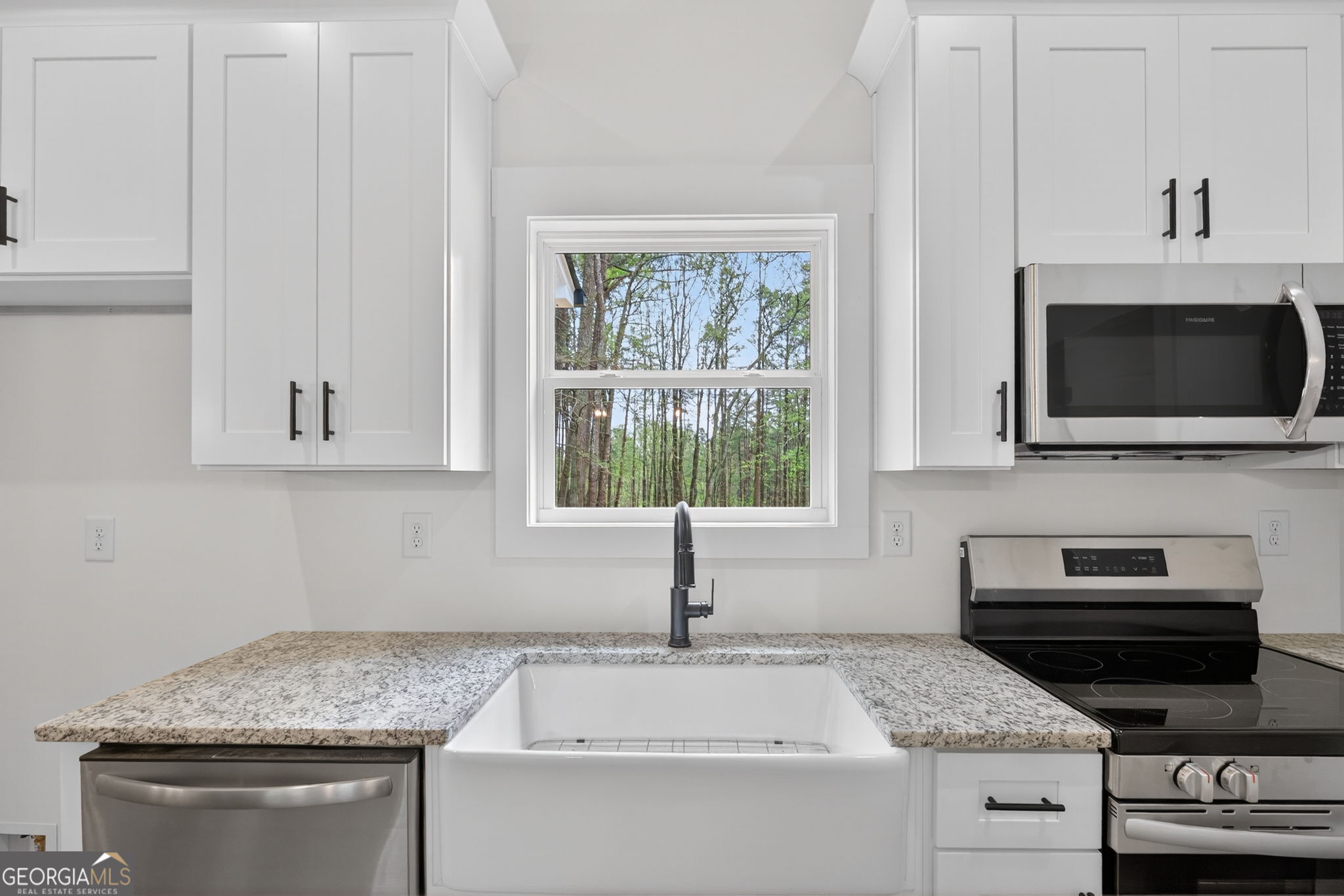 1081 Drummond Road Cedartown, GA 30125 - Photo 34 of 67 a kitchen with granite countertop a sink and a stove top oven