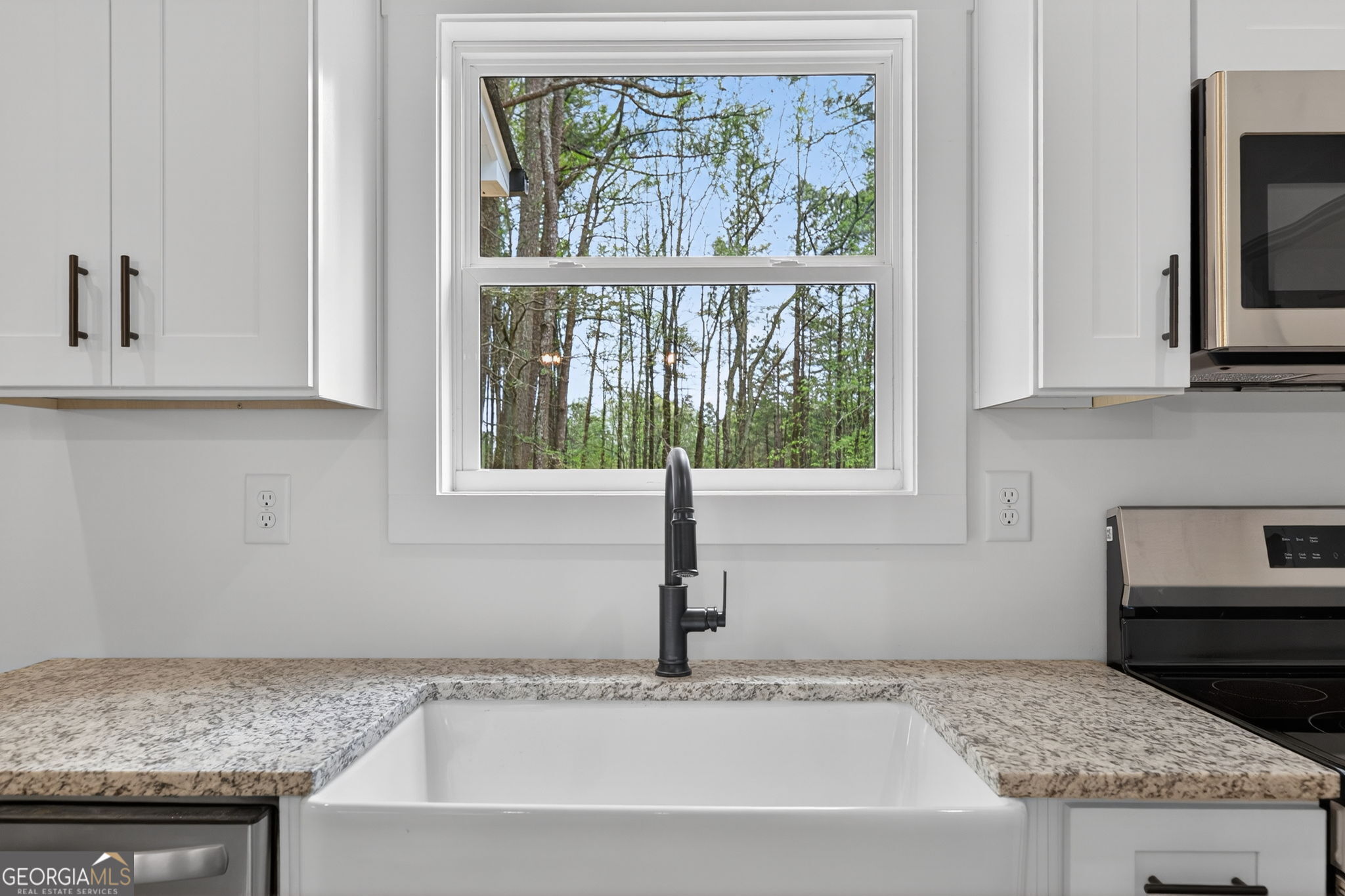 1081 Drummond Road Cedartown, GA 30125 - Photo 36 of 67 a kitchen with granite countertop a sink and a window