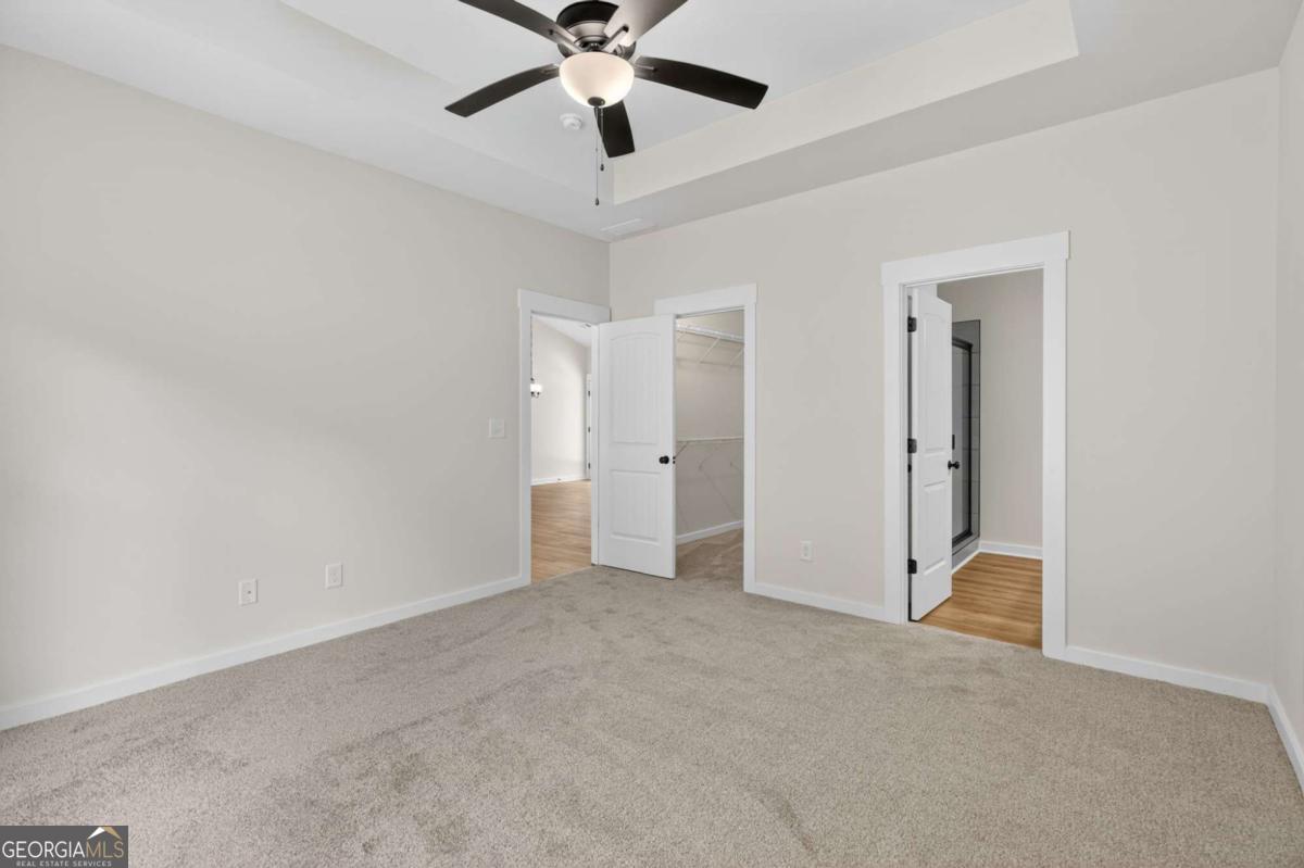 1081 Drummond Road Cedartown, GA 30125 - Photo 37 of 67 an empty room with closet and a chandelier fan