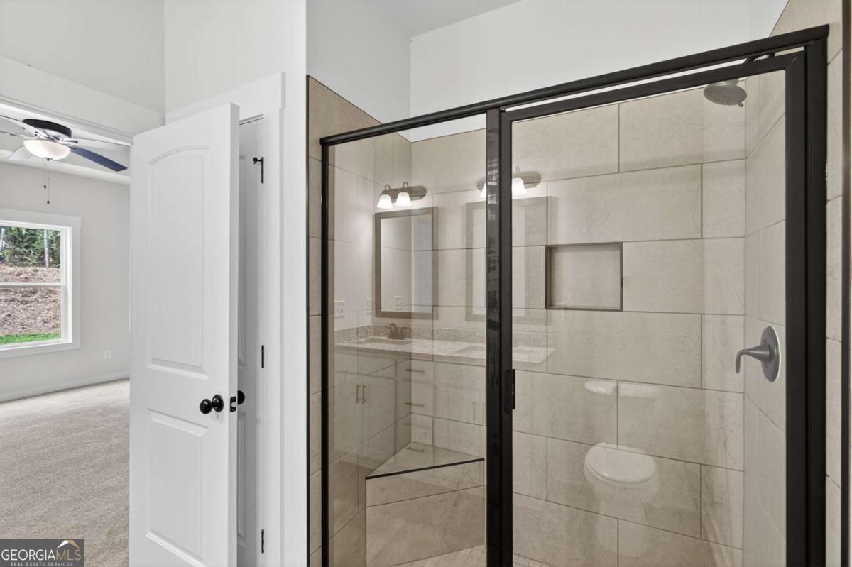 1081 Drummond Road Cedartown, GA 30125 - Photo 41 of 67 a bathroom with a glass shower door