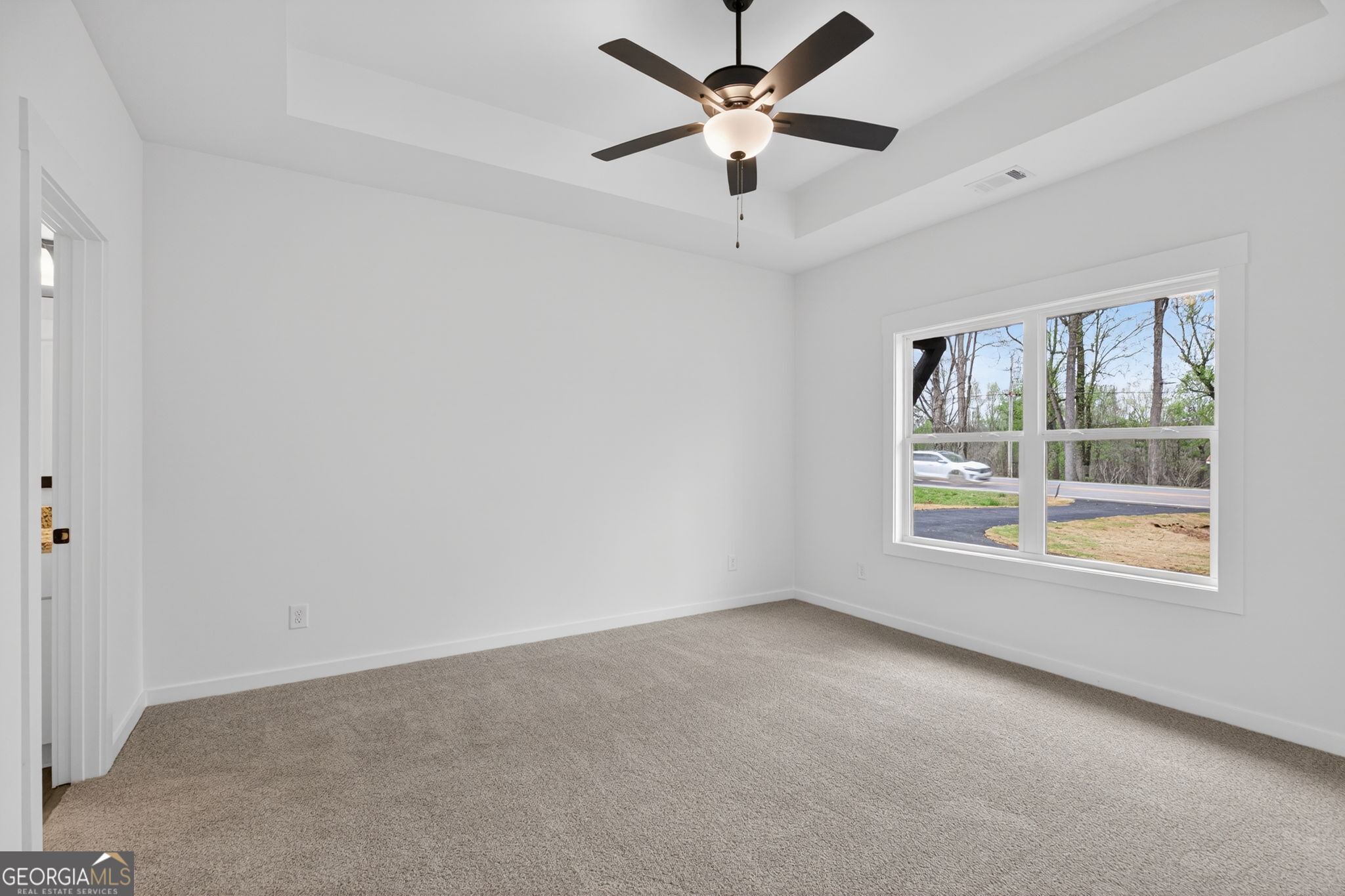 1081 Drummond Road Cedartown, GA 30125 - Photo 42 of 67 an empty room with a window and a fan