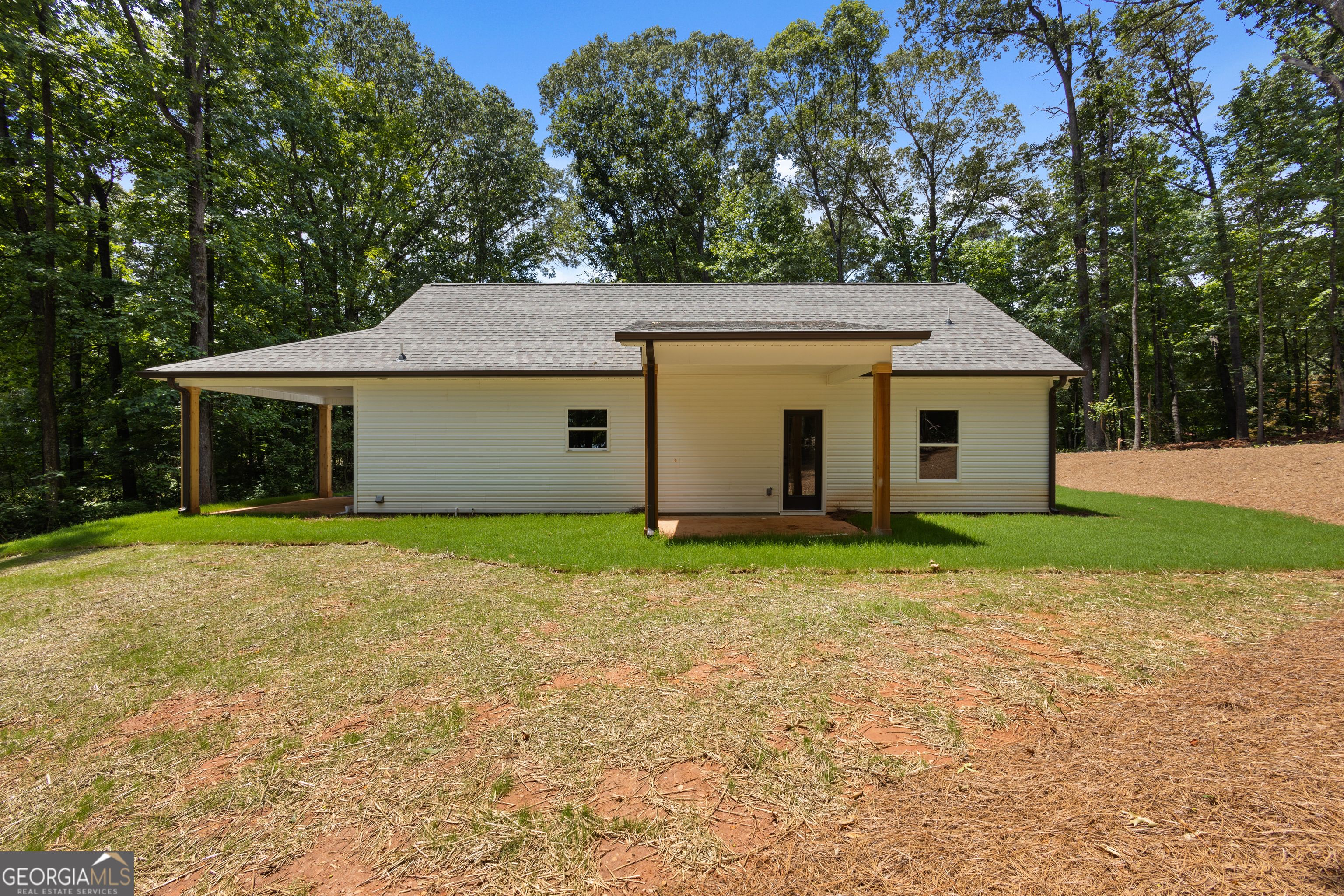 1081 Drummond Road Cedartown, GA 30125 - Photo 54 of 67 a view of a house with a yard and large tree