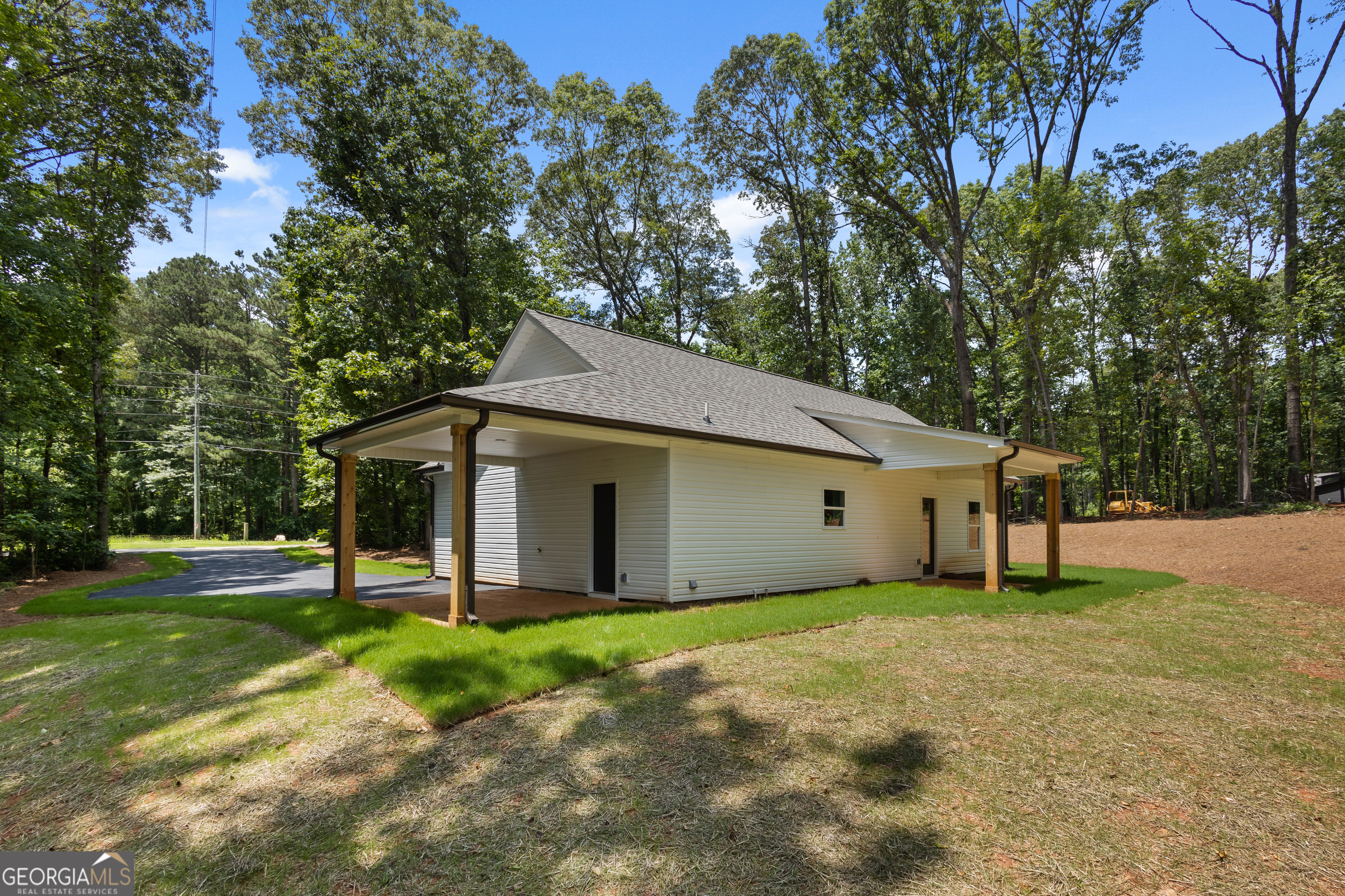 1081 Drummond Road Cedartown, GA 30125 - Photo 58 of 67 a white house that has a tree in front of it