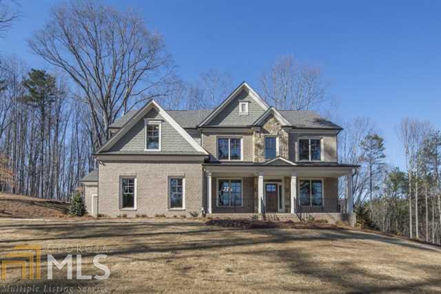 16625 Freemanville Road, Unit 4 Milton, GA 30004 - Photo 1 of 1 a front view of a house with a yard