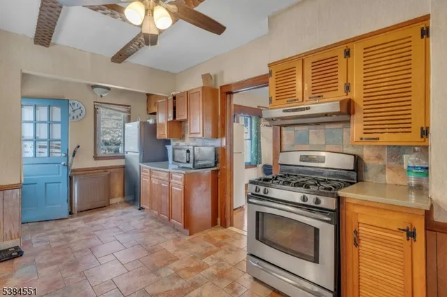 a kitchen with a stove and a microwave