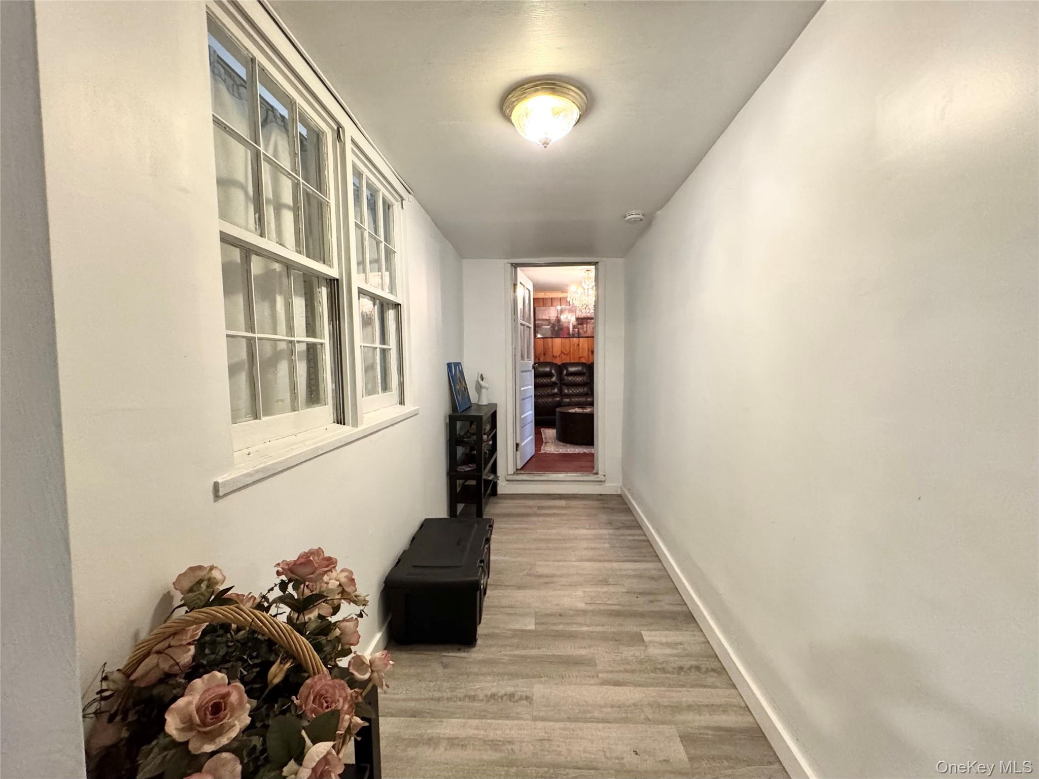 214 County Route 67 Cairo, NY 12413 - Photo 15 of 21 a view of a hallway with wooden floor and a living room