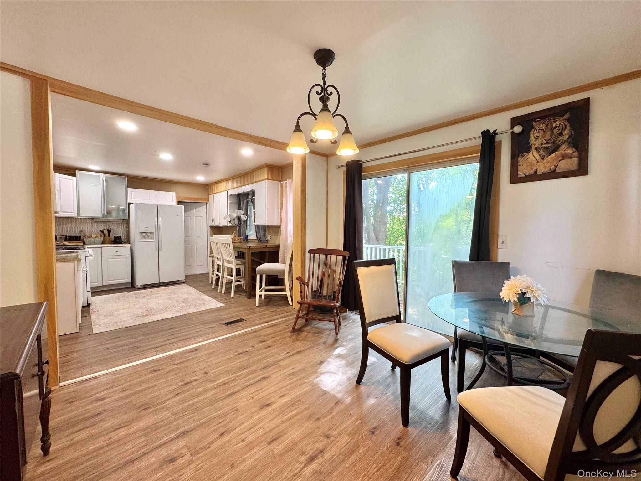 214 County Route 67 Cairo, NY 12413 - Photo 3 of 21 a view of a dining room with furniture window and wooden floor