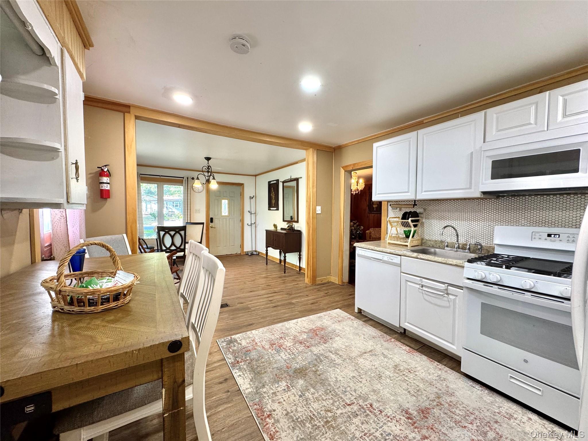 214 County Route 67 Cairo, NY 12413 - Photo 6 of 21 a large kitchen with cabinets table and chairs