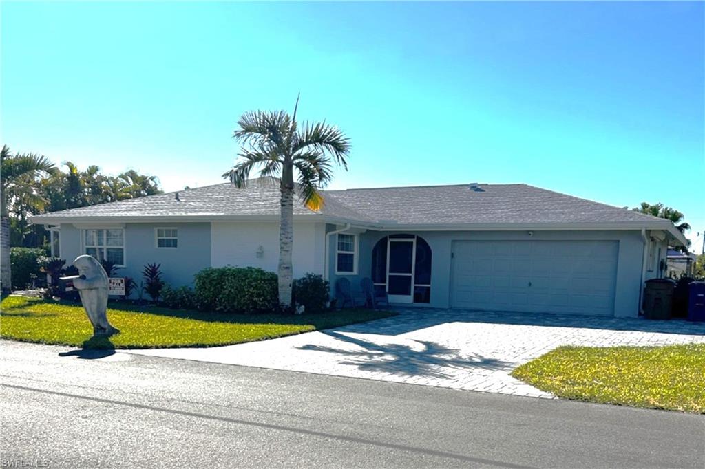 13511 Island Road Fort Myers, FL 33905 - Photo 2 of 38 a house view with a backyard space