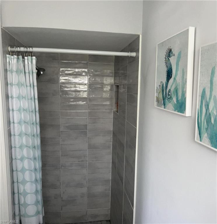 13511 Island Road Fort Myers, FL 33905 - Photo 22 of 38 a bathroom with a shower