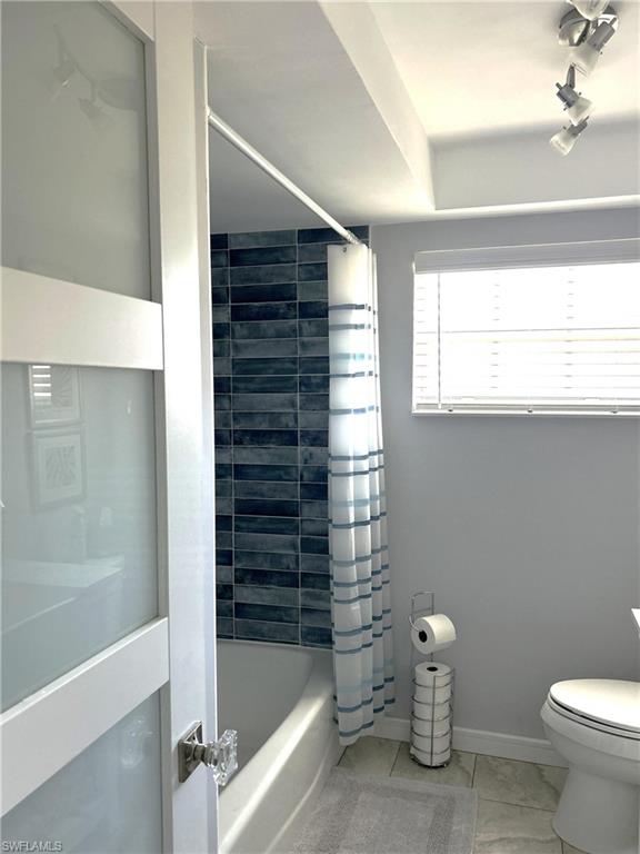 13511 Island Road Fort Myers, FL 33905 - Photo 28 of 38 a bathroom with a bathtub and a shower