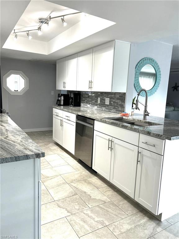 13511 Island Road Fort Myers, FL 33905 - Photo 9 of 38 a kitchen with a sink cabinets and window