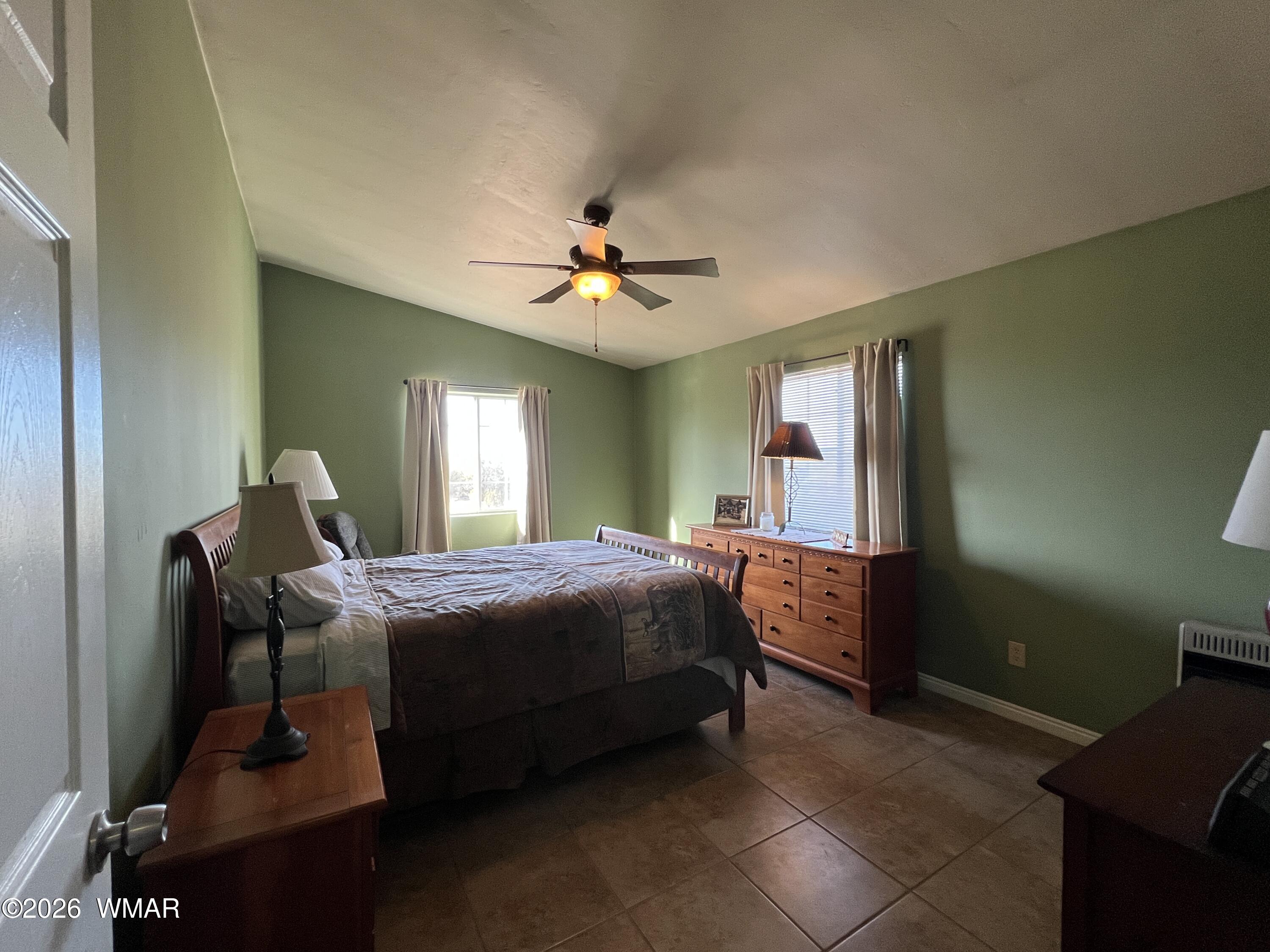 25 North County Road St. Johns, AZ 85936 - Photo 16 of 55 a bedroom with a bed and window
