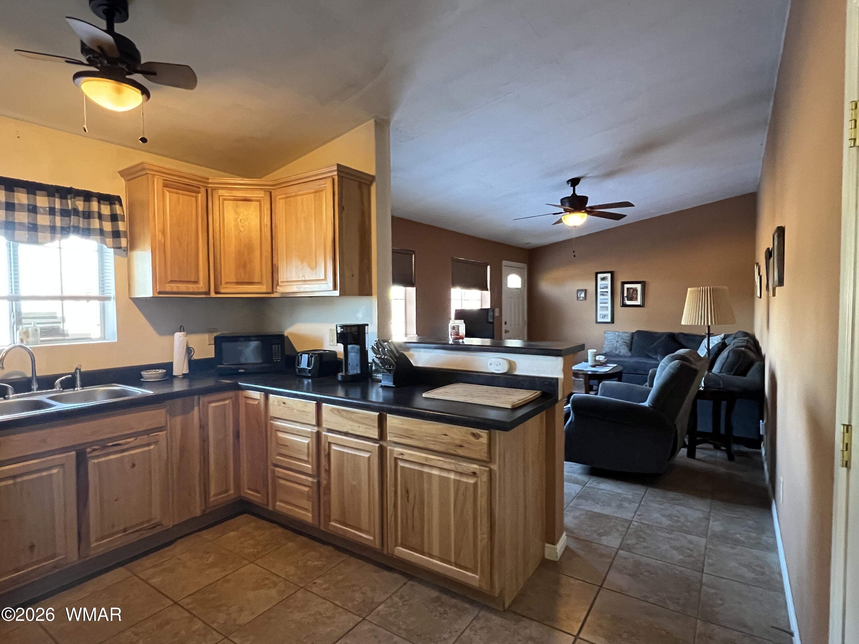 25 North County Road St. Johns, AZ 85936 - Photo 9 of 55 a kitchen with a sink and cabinets