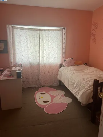 a bedroom with a bed and a table