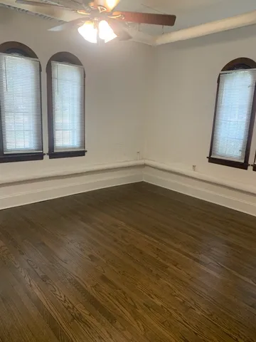 a view of a livingroom with wooden floor