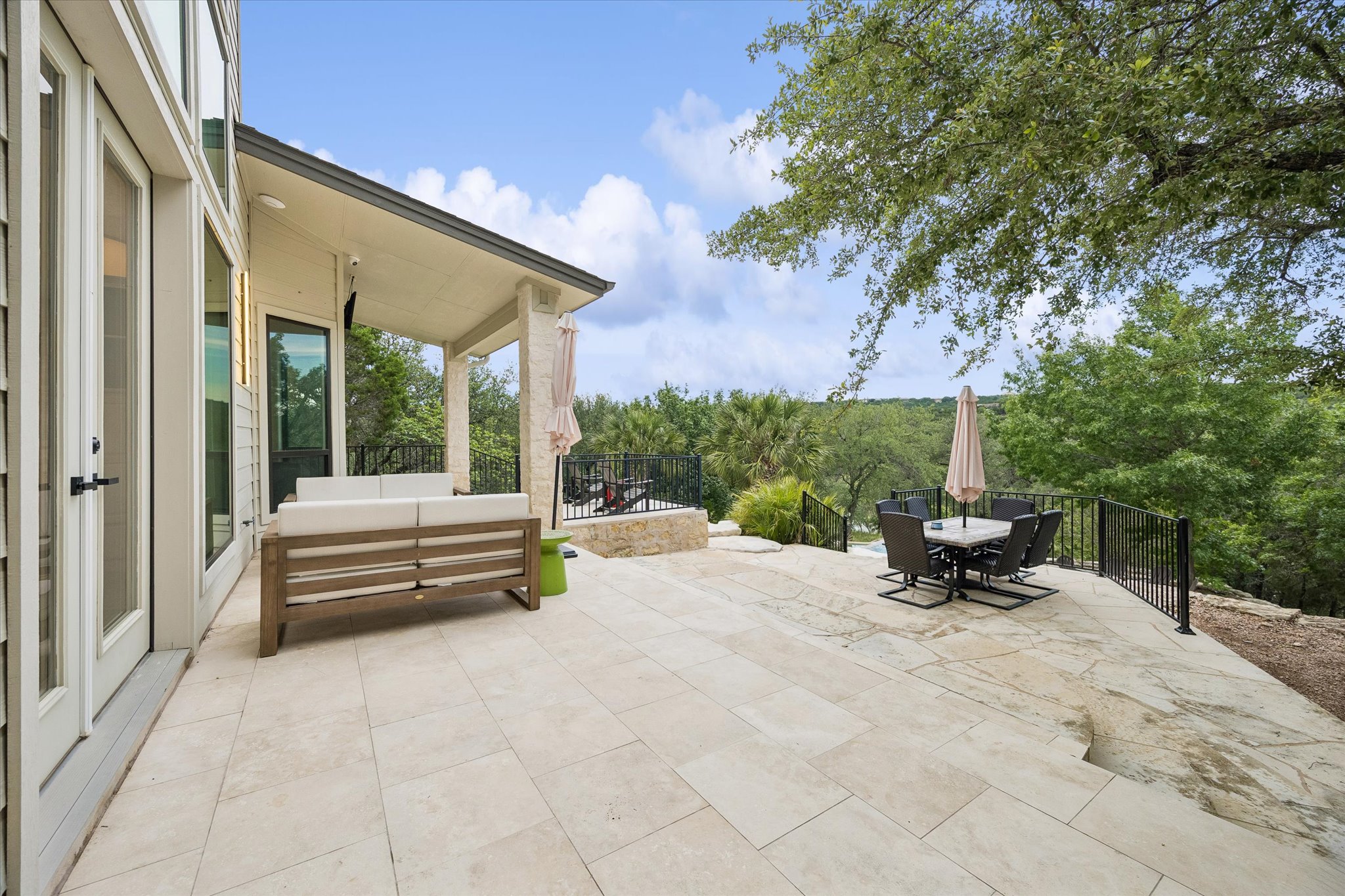 3719 Bee Creek Road Spicewood, TX 78669 - Photo 29 of 40 A spacious outdoor patio, perfect for enjoying the scenic views and natural surroundings.