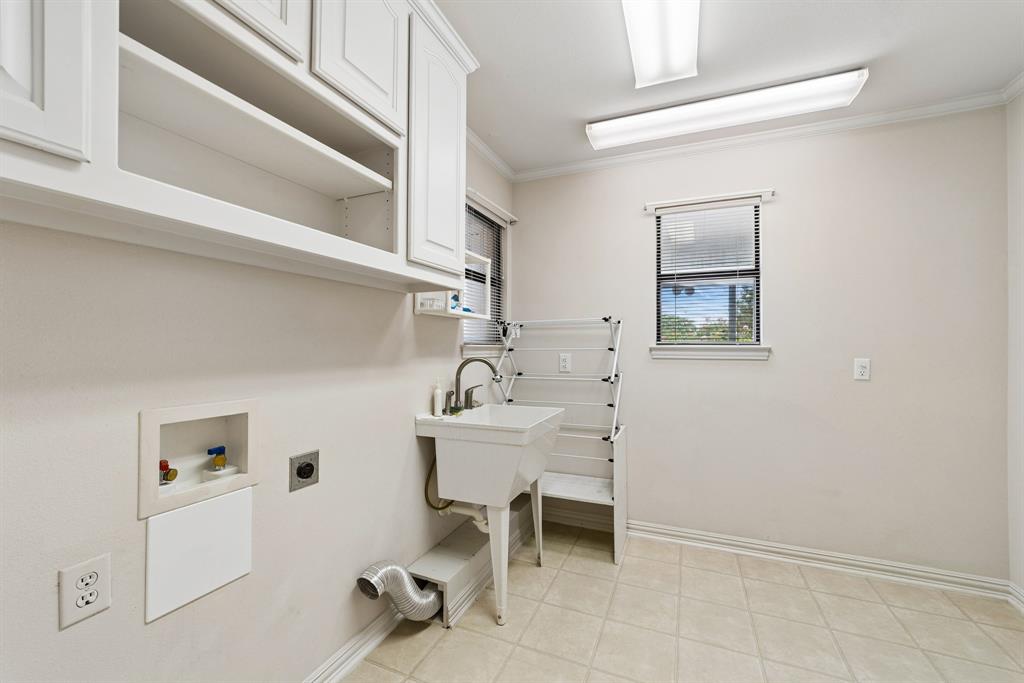 1175 Bloom Street Lucas, TX 75002 - Photo 26 of 36 a white building with a sink and chair