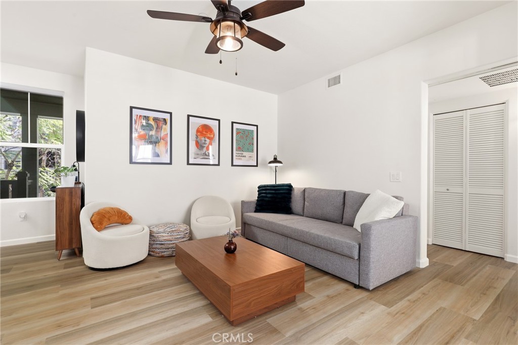 52 Valmont Way Ladera Ranch, CA 92694 - Photo 6 of 29 a living room with furniture and a wooden floor
