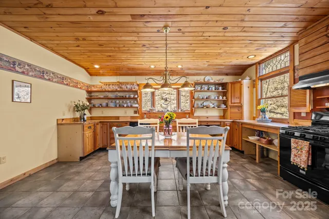 a kitchen with stainless steel appliances granite countertop a stove and a refrigerator