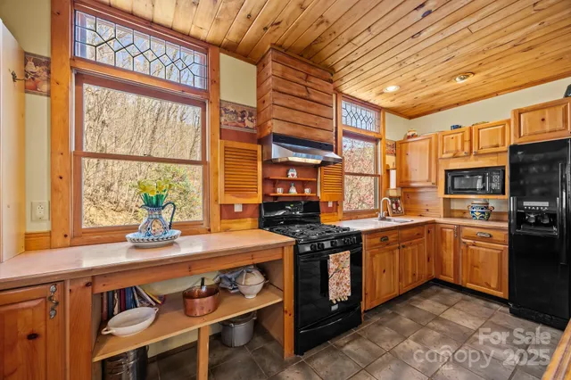 a view of a sink and a window