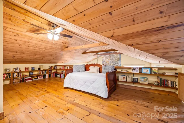 a bedroom with furniture and a rug