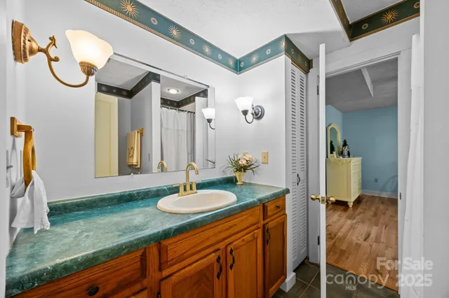 a view of a hallway with entryway and furniture