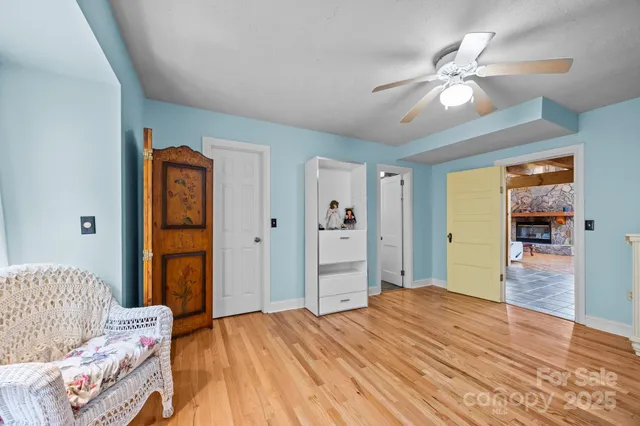 a kitchen with cabinets and wooden floor